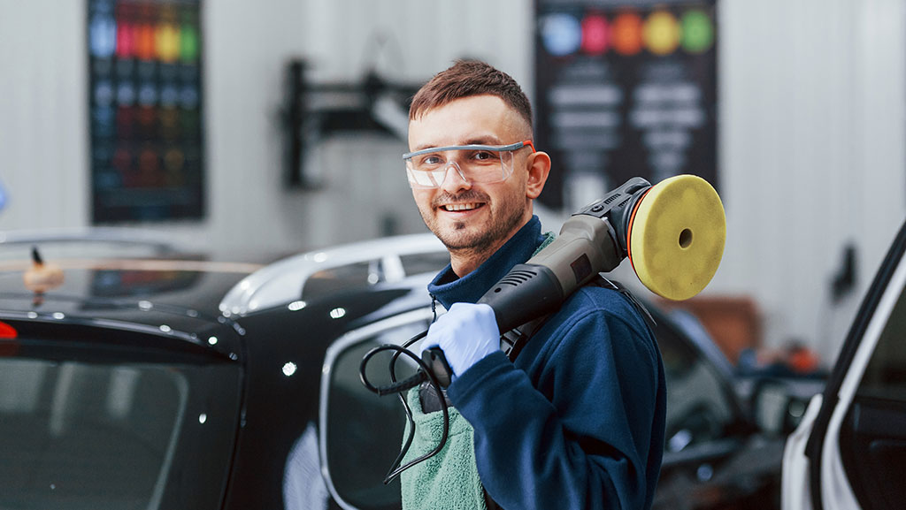 Male Worker Uniform Polishing New Modern Car